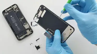 Technician repairing a smartphone